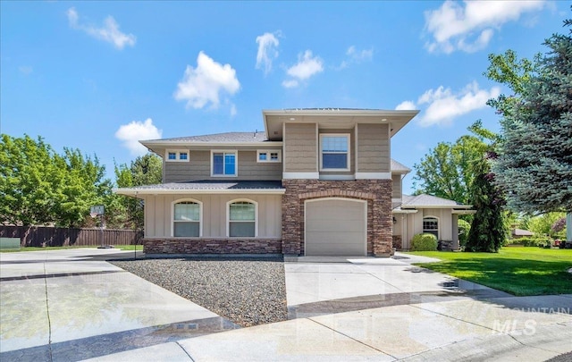 6370 E Escarpment Ct, Boise, ID 83716 - view of front of house with driveway, stone siding, board and batten siding, and an attached garage