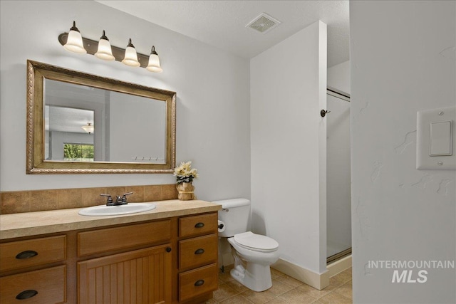 6370 E Escarpment Ct, Boise, ID 83716 - bathroom featuring toilet, vanity, tile patterned flooring, and a shower stall