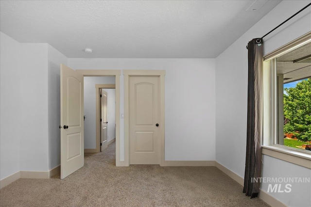 6370 E Escarpment Ct, Boise, ID 83716 - empty room featuring light carpet, baseboards, and a smoke detector