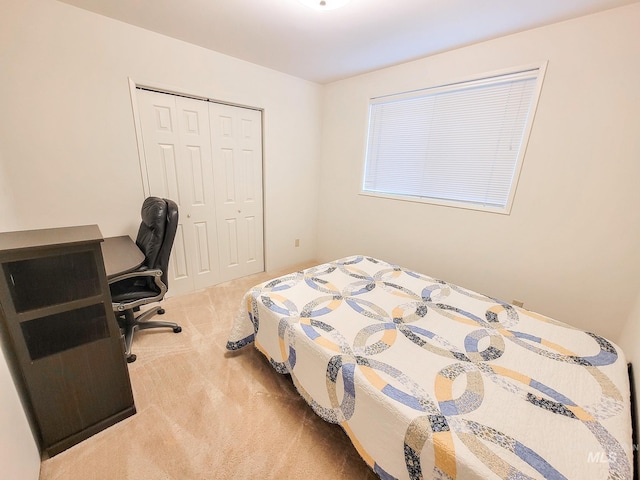 carpeted bedroom featuring a closet