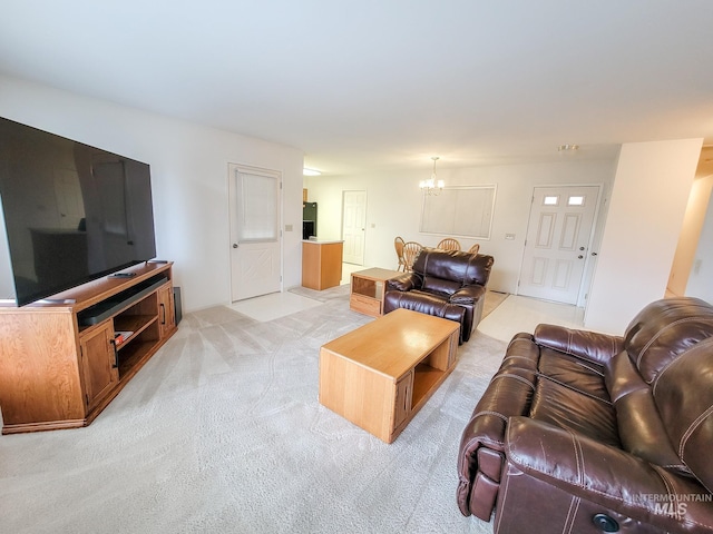 living area featuring a chandelier and light carpet