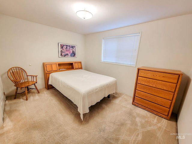 bedroom with light colored carpet