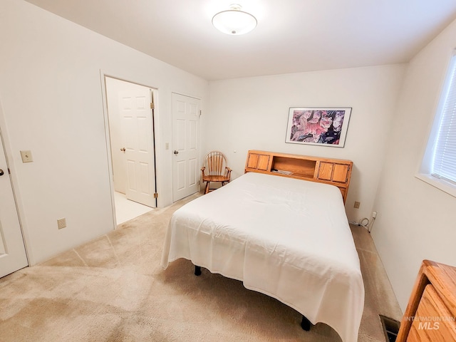 bedroom with light carpet