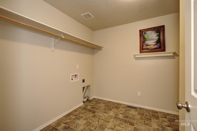 clothes washing area featuring electric dryer hookup, visible vents, baseboards, hookup for a washing machine, and laundry area