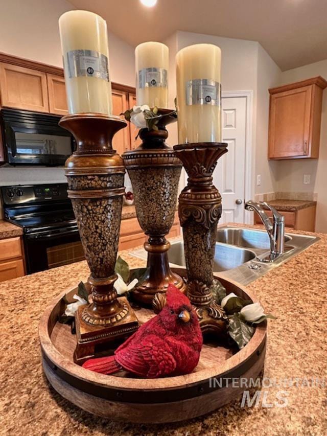 room details featuring black appliances and light countertops