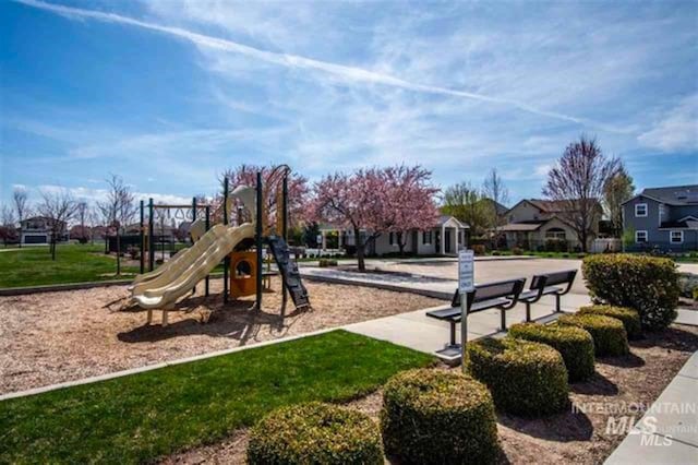 community jungle gym with a residential view