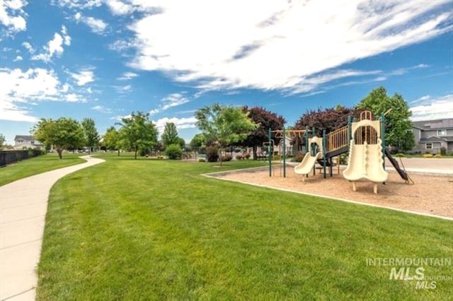 communal playground with a lawn