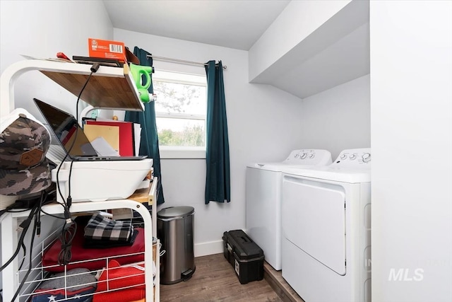 laundry room with independent washer and dryer, baseboards, laundry area, and wood finished floors