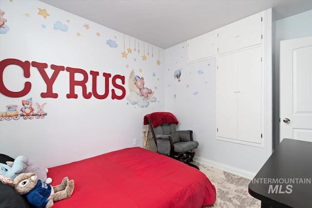 bedroom featuring baseboards