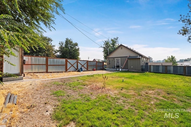 view of yard with a fenced backyard