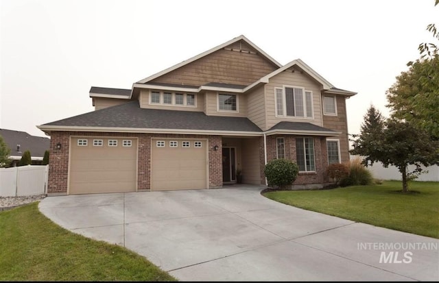 view of front of house with a front lawn and a garage