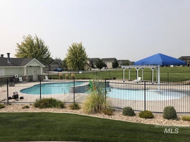 view of pool featuring a lawn, a patio area, and a pergola