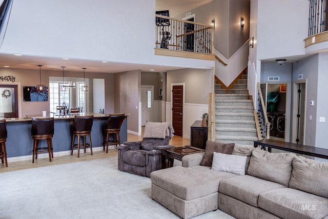 living room featuring a high ceiling