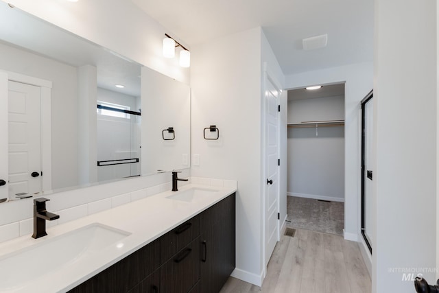 5391 S Memory Pl, Meridian, ID 83642 - full bath with wood finished floors, double vanity, a spacious closet, and baseboards