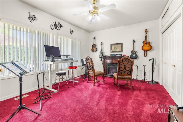 office area featuring baseboards, carpet, a ceiling fan, and visible vents