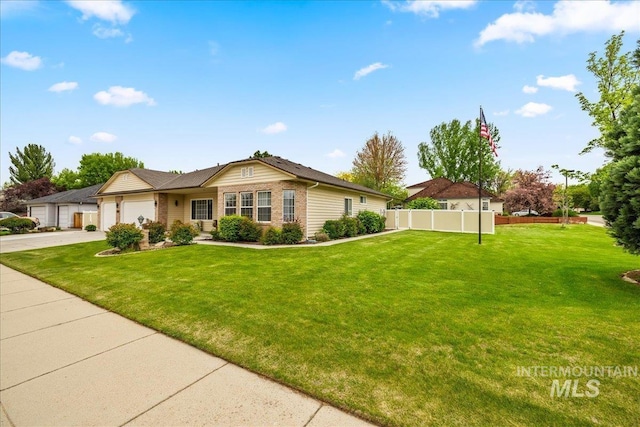 ranch-style house featuring a front yard, brick siding, fence, concrete driveway, and an attached garage