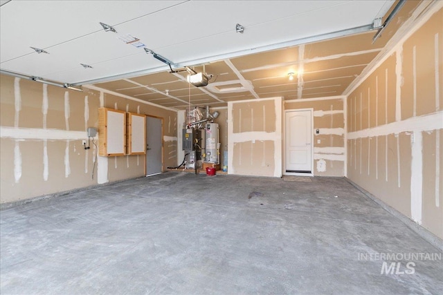 garage with gas water heater and a garage door opener