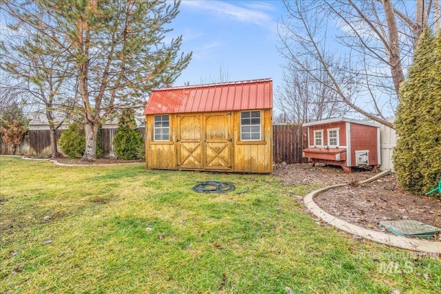 view of shed featuring a fenced backyard