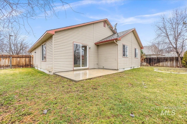 back of house with a patio, crawl space, and a fenced backyard