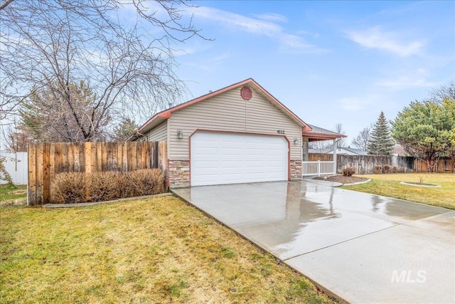 exterior space with driveway, stone siding, fence, a front lawn, and a porch