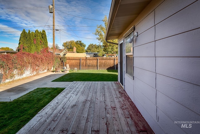 wooden terrace with a yard