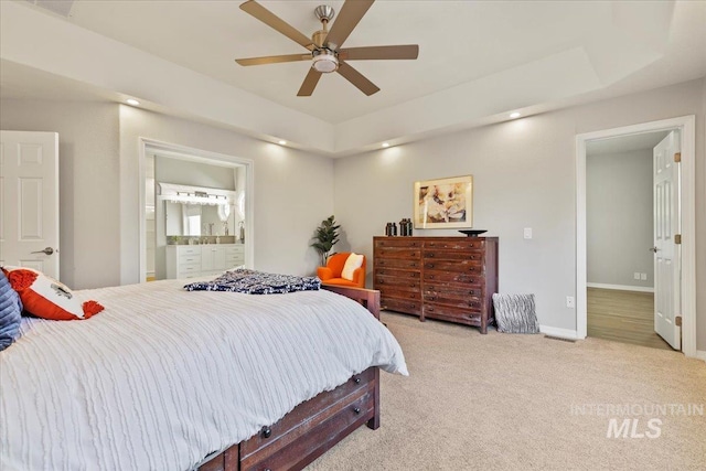 5915 N Lilybrook Pl, Boise, ID 83713 - carpeted bedroom featuring baseboards, connected bathroom, and a ceiling fan