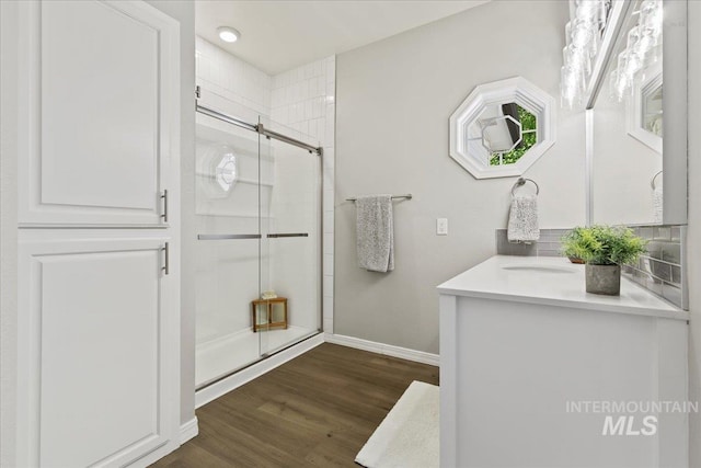 5915 N Lilybrook Pl, Boise, ID 83713 - full bath featuring vanity, a stall shower, baseboards, wood finished floors, and recessed lighting