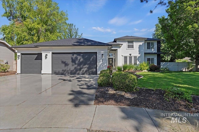 5915 N Lilybrook Pl, Boise, ID 83713 - view of front facade with an attached garage, driveway, and stucco siding
