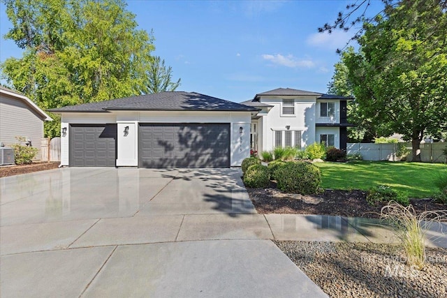 5915 N Lilybrook Pl, Boise, ID 83713 - prairie-style house featuring a garage, concrete driveway, central air condition unit, and stucco siding