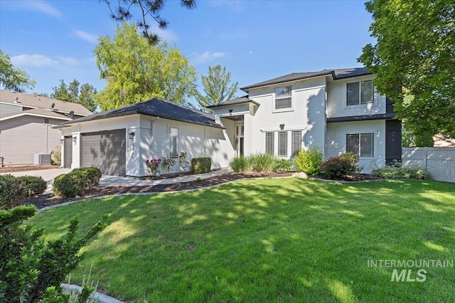 5915 N Lilybrook Pl, Boise, ID 83713 - view of front of house featuring an attached garage, roof mounted solar panels, central AC unit, and concrete driveway