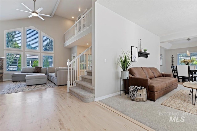 5915 N Lilybrook Pl, Boise, ID 83713 - living room with high vaulted ceiling, a ceiling fan, wood finished floors, stairway, and baseboards