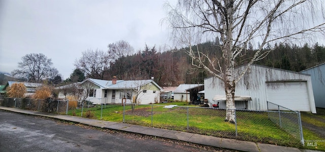 view of front facade with a front yard and a garage