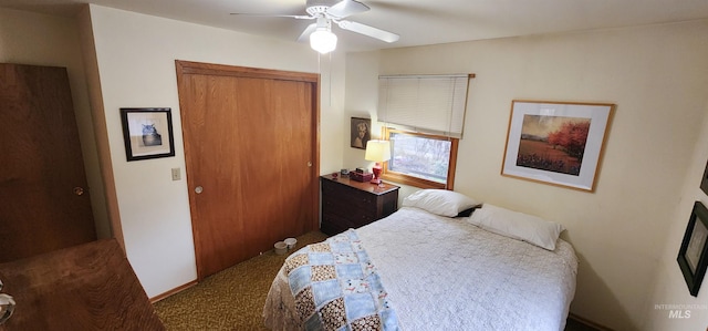 bedroom with ceiling fan and a closet