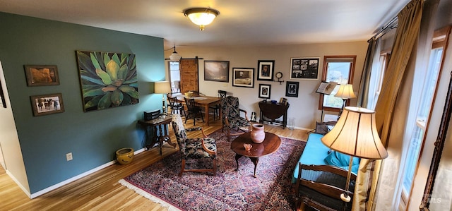 sitting room with wood-type flooring