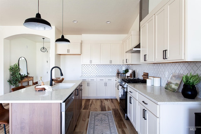kitchen with a sink, range with gas cooktop, white cabinetry, wood finished floors, and dishwasher