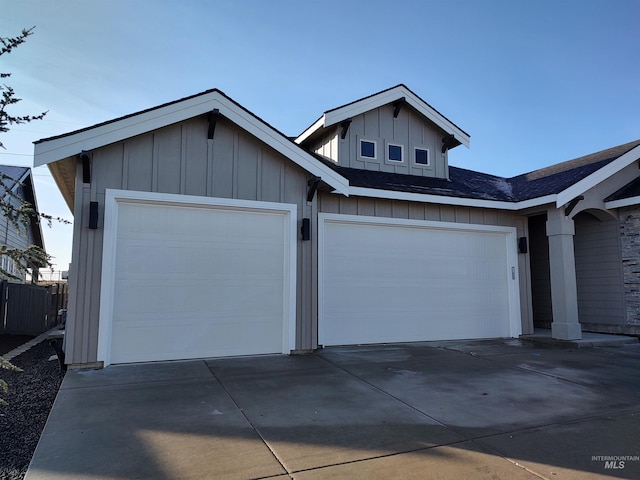 view of front of home featuring a garage, board and batten siding, and driveway