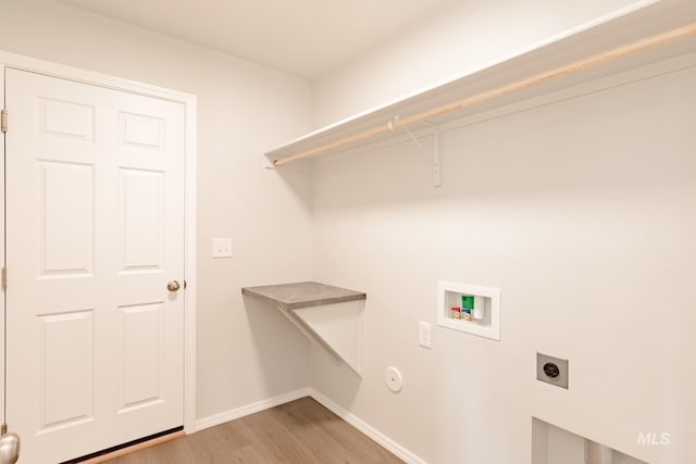 washroom featuring electric dryer hookup, washer hookup, and light hardwood / wood-style flooring