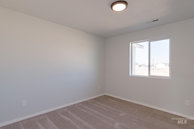 empty room featuring carpet floors