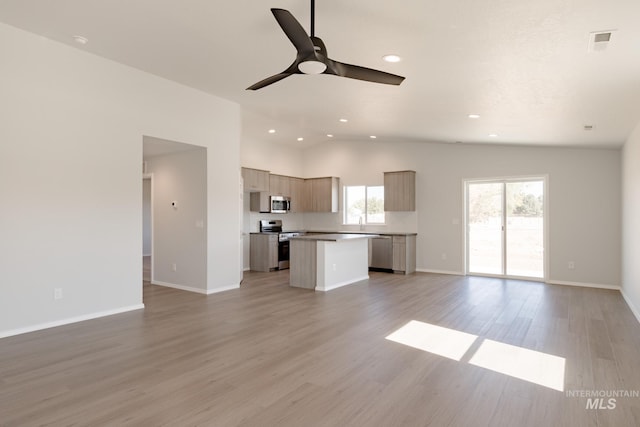 unfurnished living room featuring light hardwood / wood-style flooring and ceiling fan