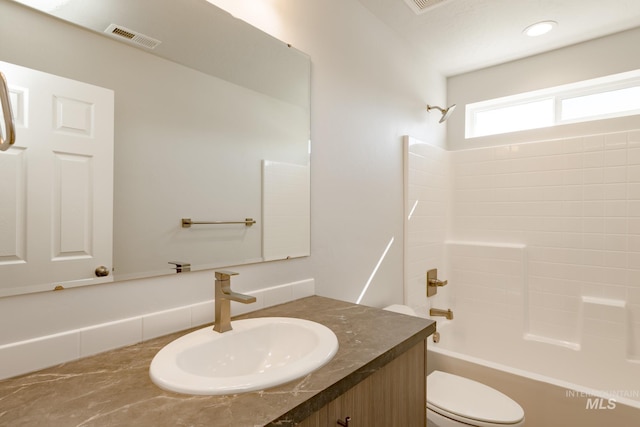 full bathroom featuring vanity, toilet, and bathing tub / shower combination