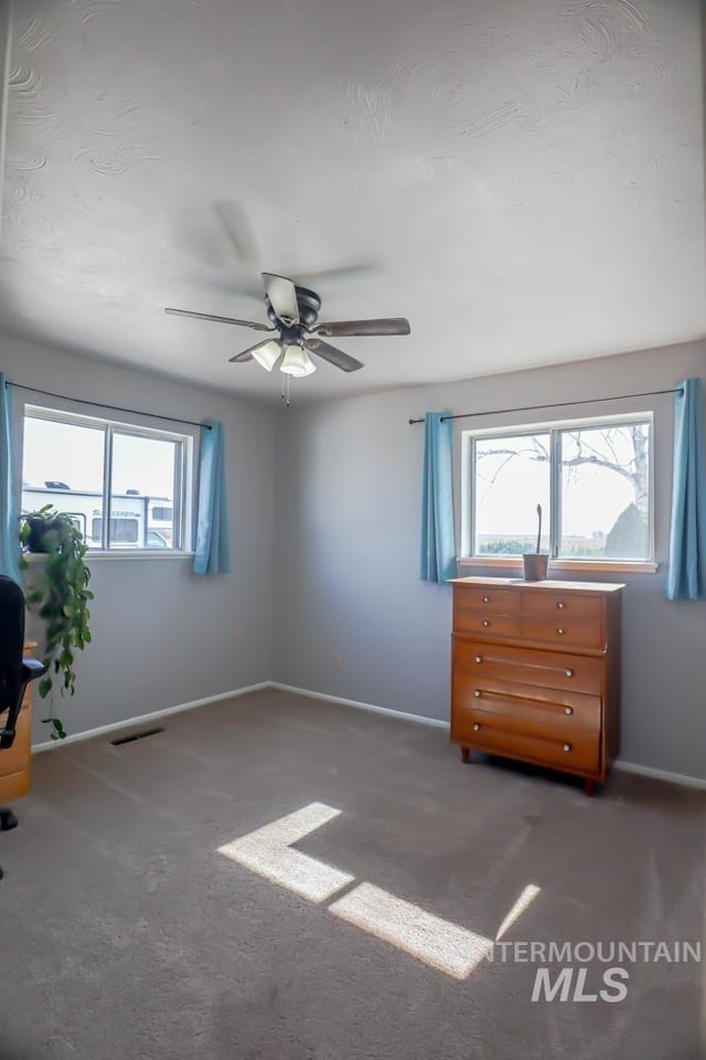 bedroom with visible vents, ceiling fan, baseboards, and carpet