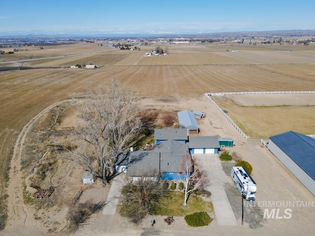 birds eye view of property with a rural view