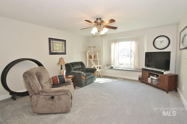 415 S Fern St, Nampa, ID 83686 - carpeted living room with baseboards and ceiling fan