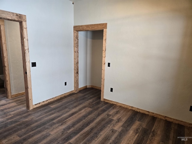 empty room featuring dark hardwood / wood-style floors