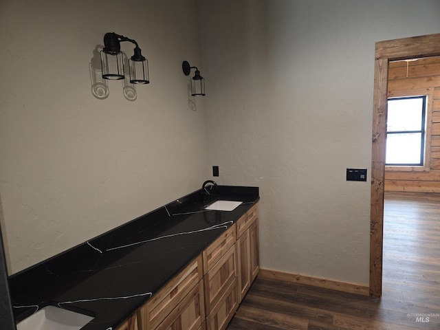 bathroom featuring vanity and wood-type flooring