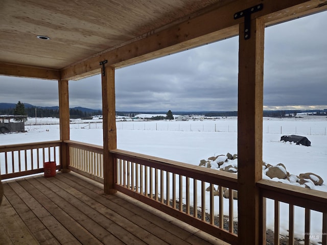 view of snow covered deck