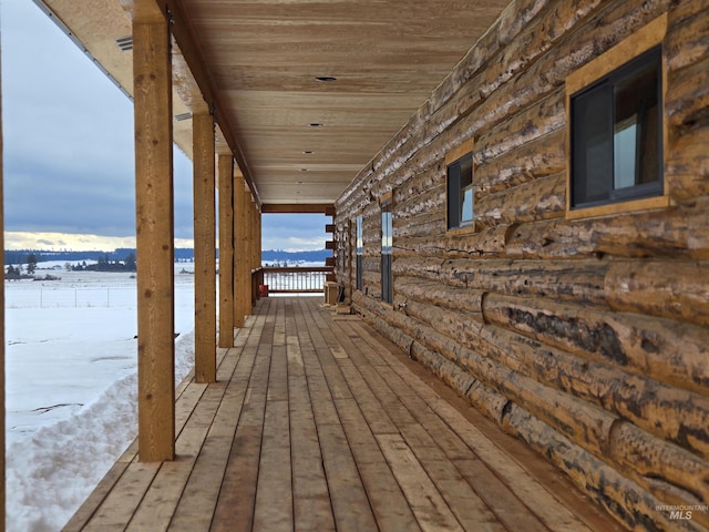 view of snow covered deck