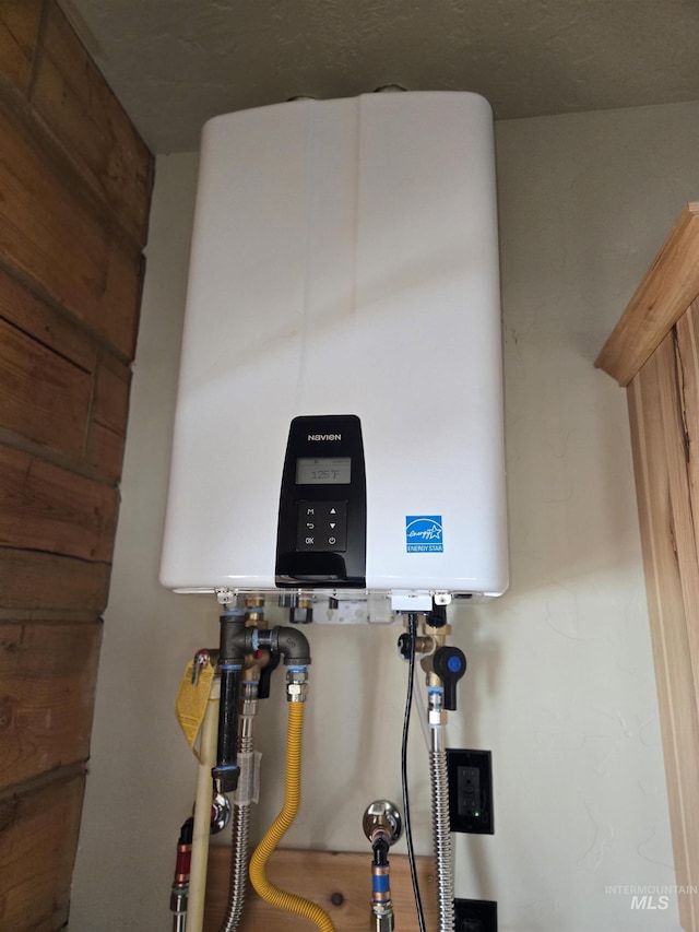 utility room with water heater