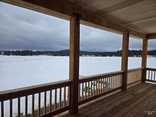 view of snow covered deck