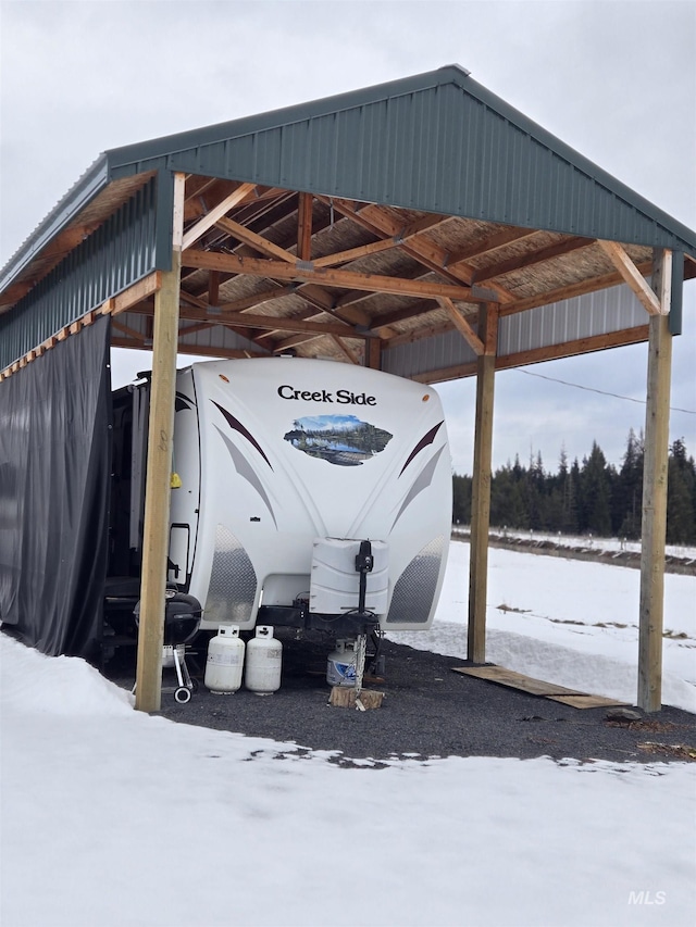 view of snow covered parking